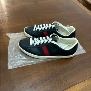 Gucci Men’s Black Leather Low-Top Sneaker with Red and White Accents